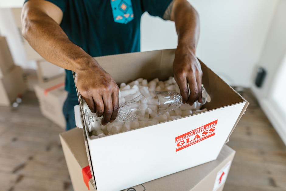 Stack of sturdy cardboard moving boxes prepared through professional packing services