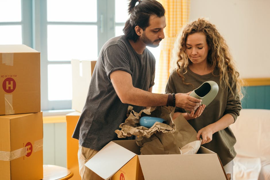 A family unpacking boxes and settling into their new home after a long distance move